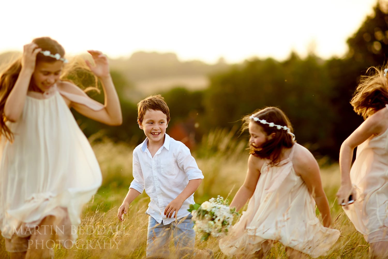 Kids play at sundown at Chafford Park wedding