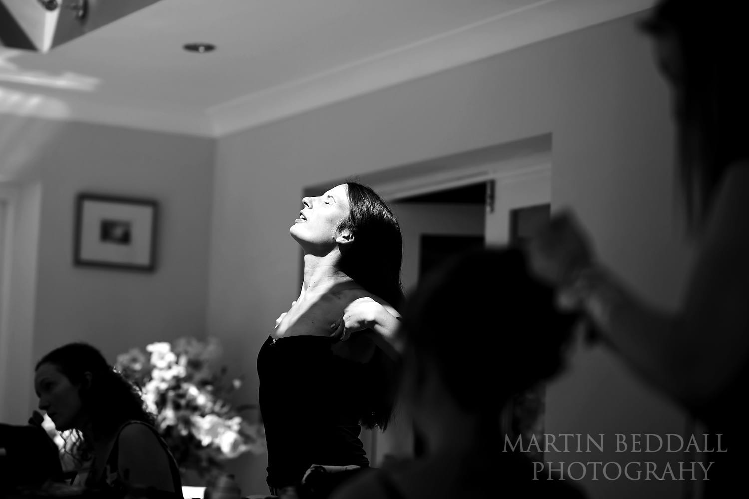 Bride feels the sunshine on her face