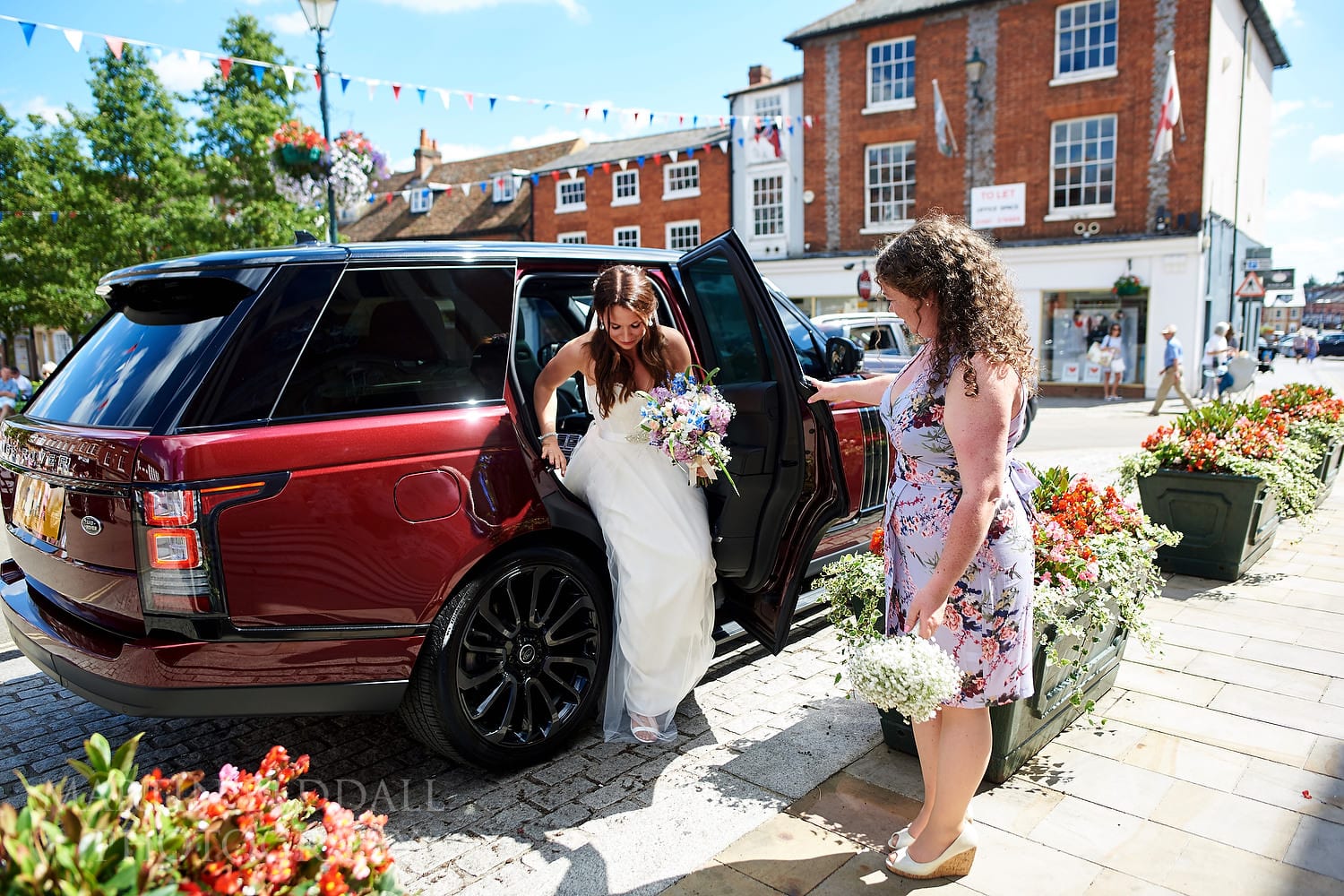 Bride arrives by car at Henley Town Hall