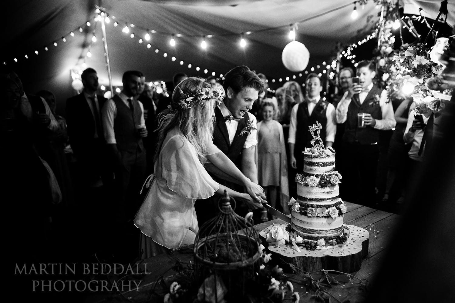 Cutting the wedding cake at East Sussex wedding
