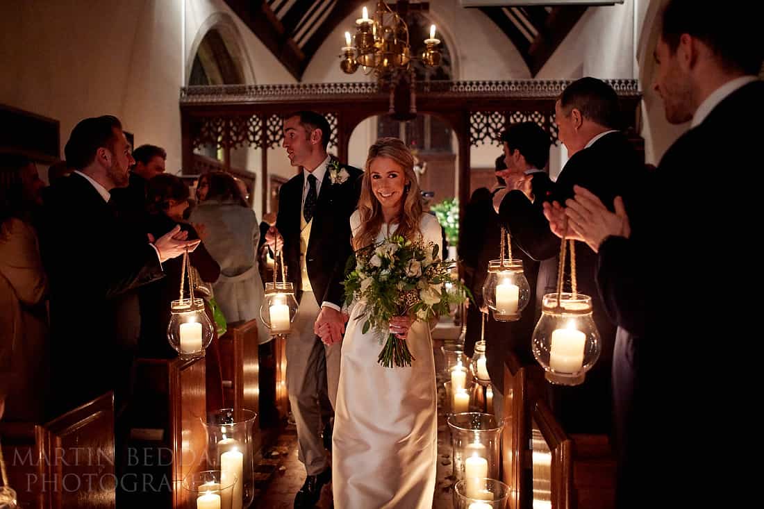 down the aisle with lanterns