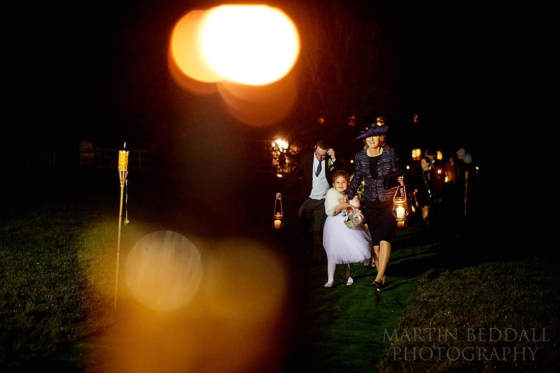 lantern carrying wedding guests