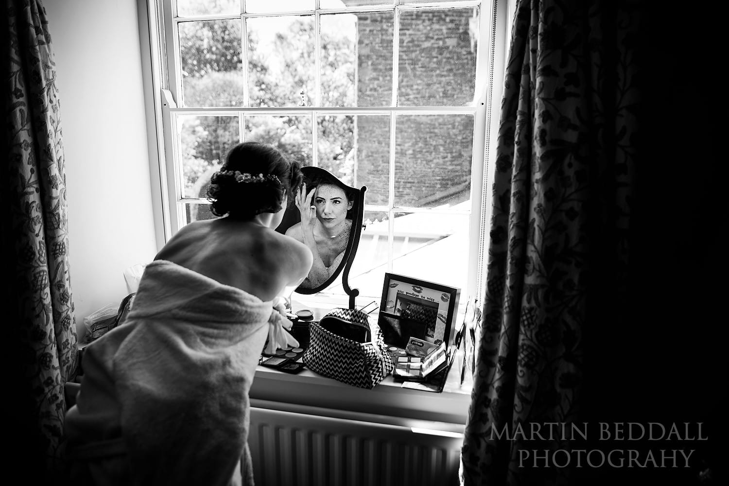 Bride getting ready at Dewsall Court