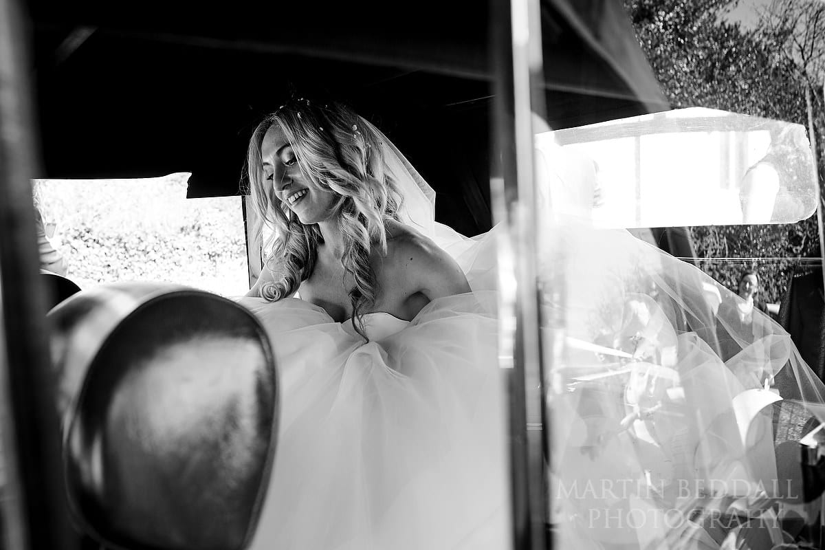 Bride in her wedding car