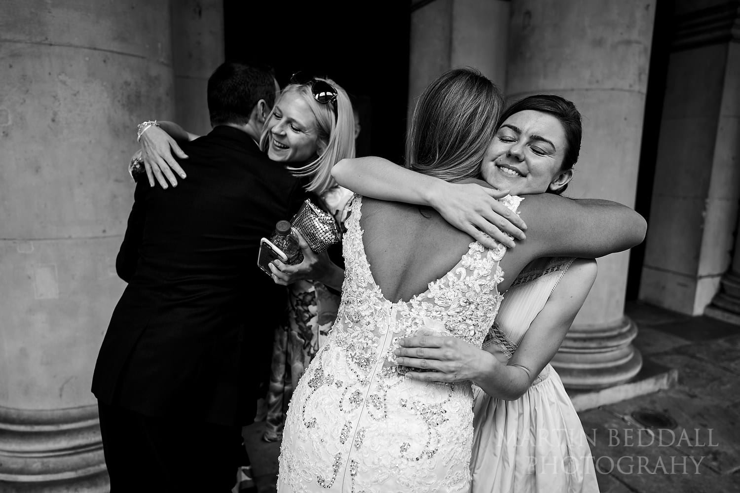 Hugs for the bride and groom outside the Bloomsbury church