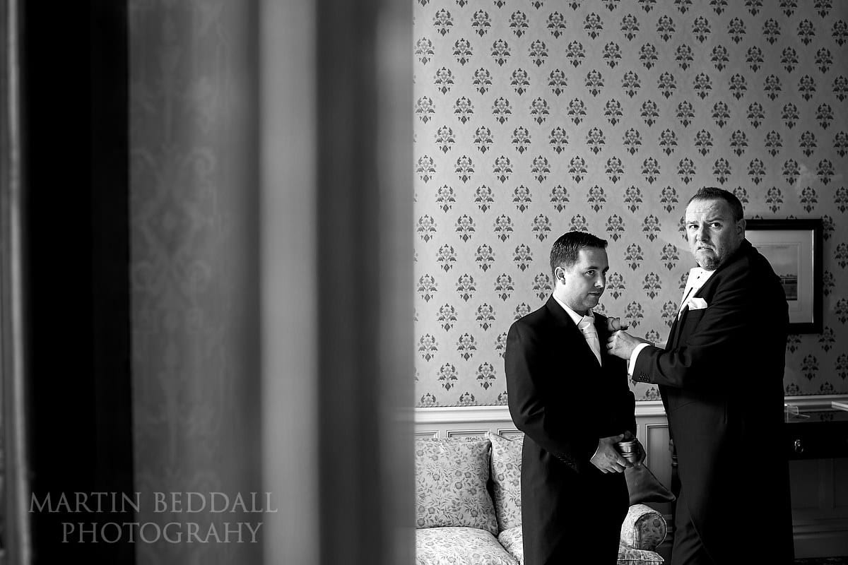 Best Man helping the groom at Horsted Place
