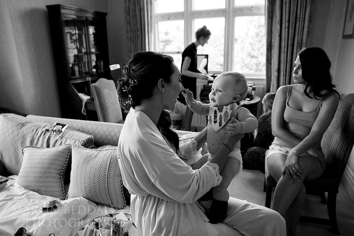 Bride plays with her young son