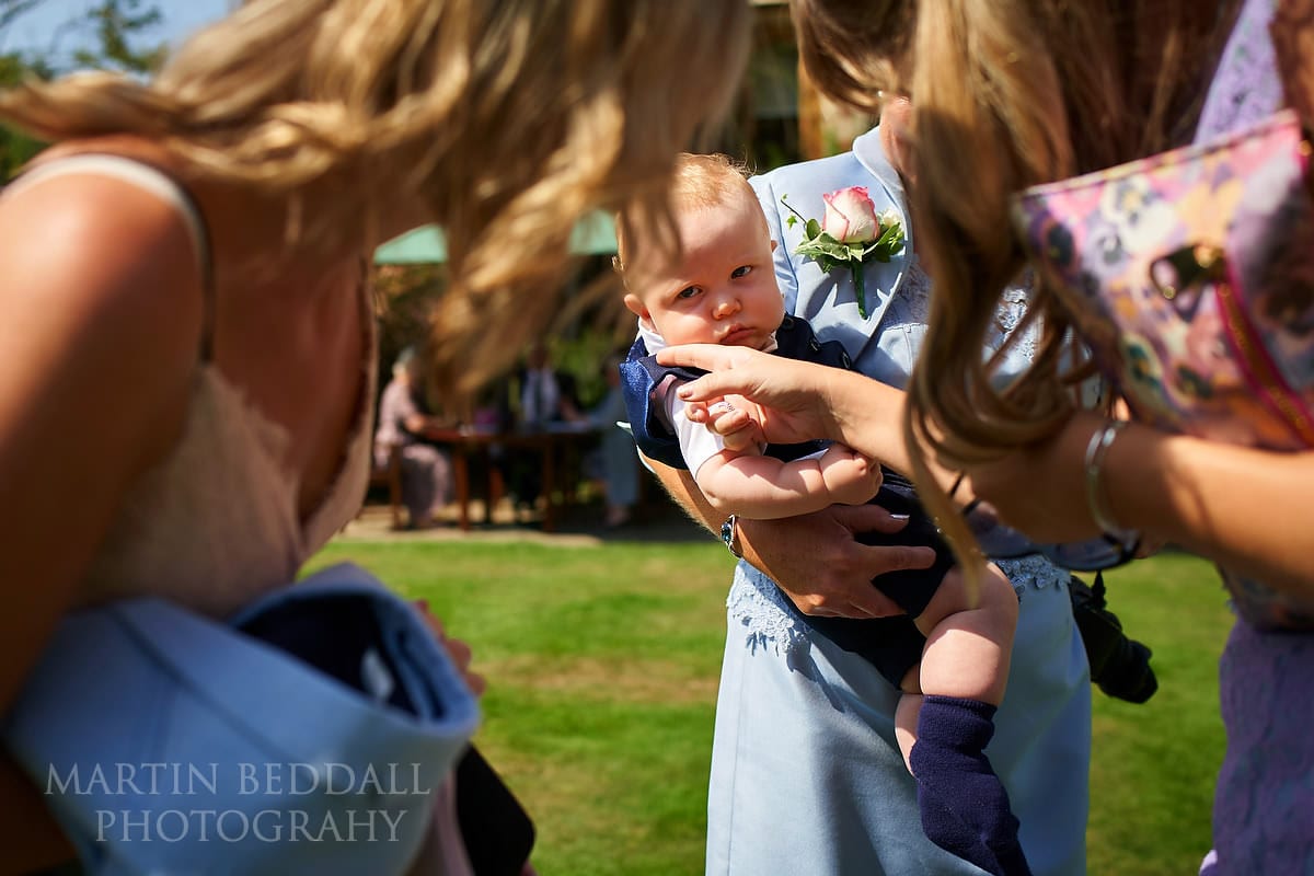 Guests meet the couple's young son