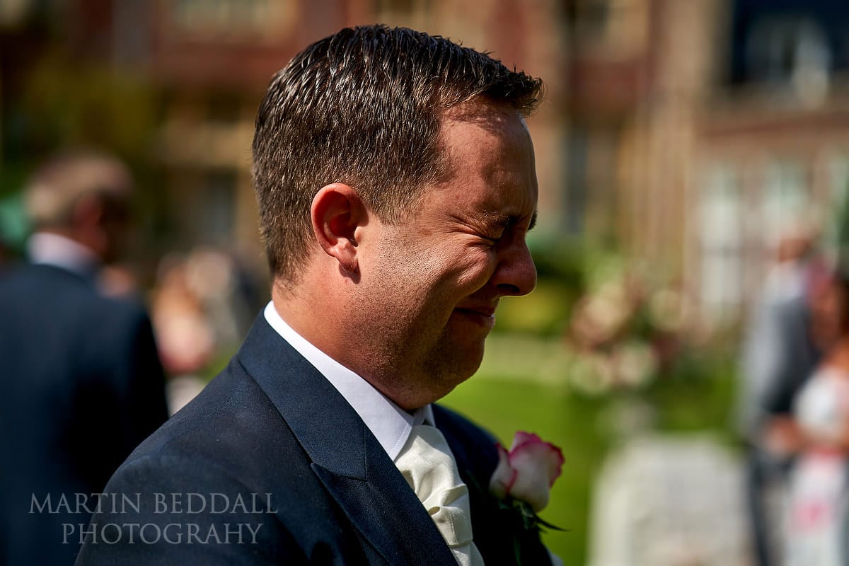 Tearful groom after seeing the bride at Horsted Place