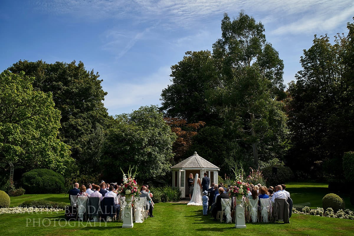 Outdoor wedding ceremony at Horsted Place in Sussex