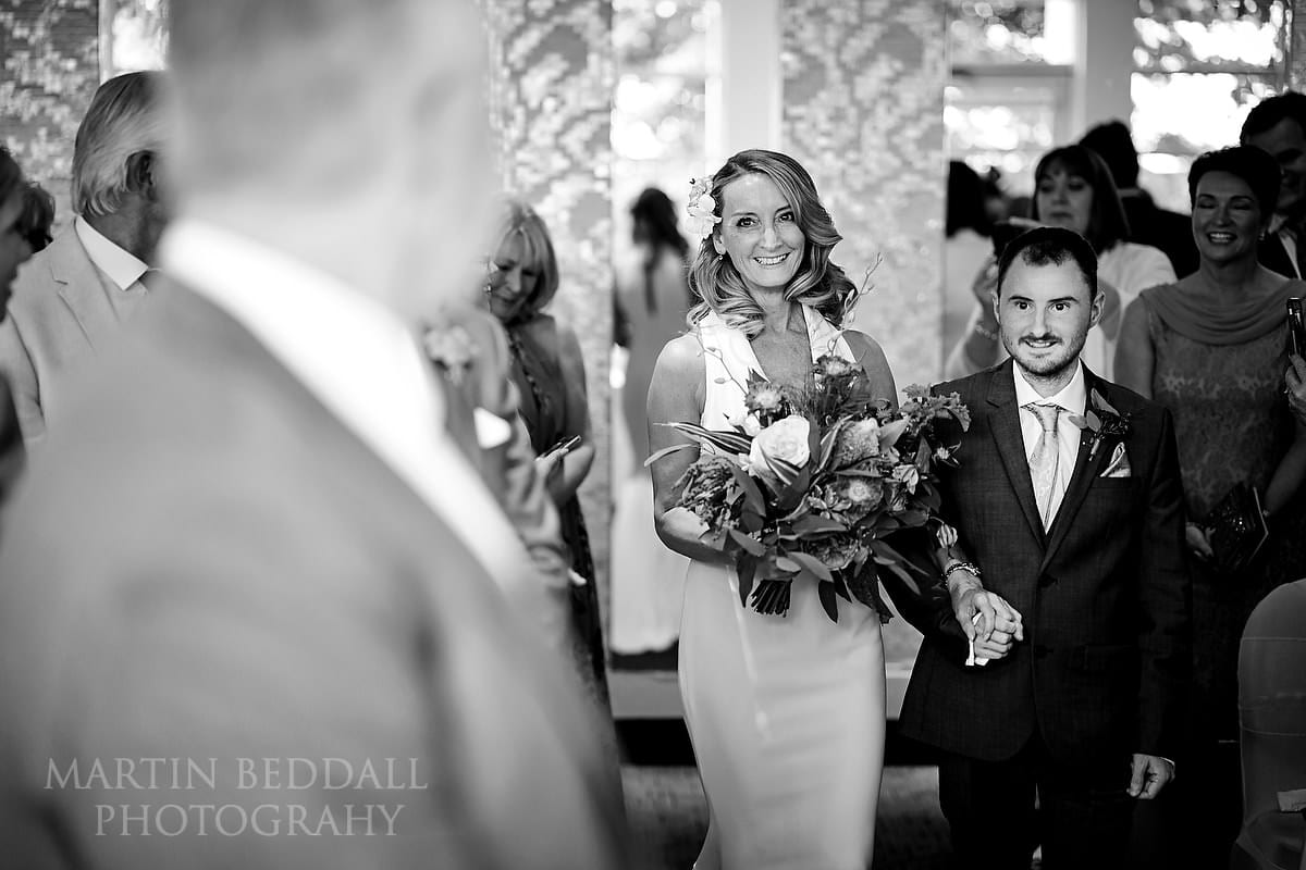 Bride escorted by her son at Kensington Roof Gardens