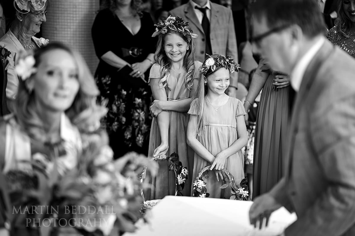 Smiling flower girls at Kensington Roof Gardens wedding