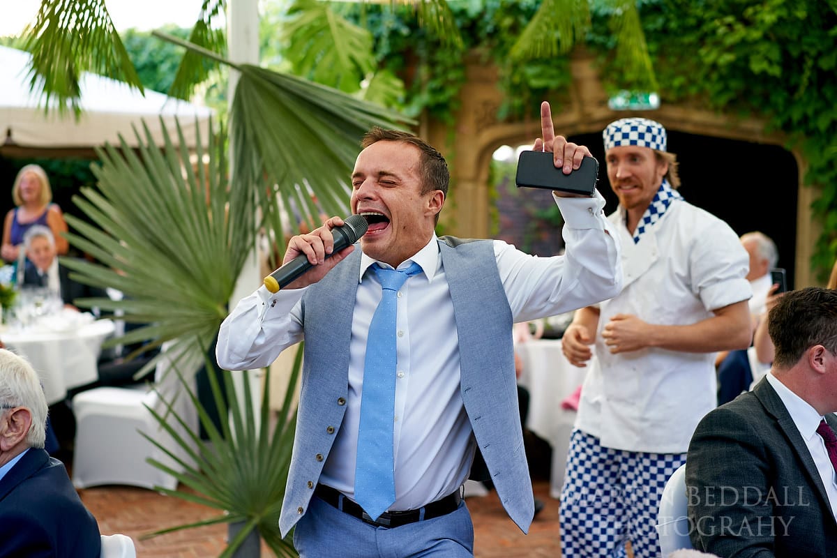 Wedding guest joins in with the singing act