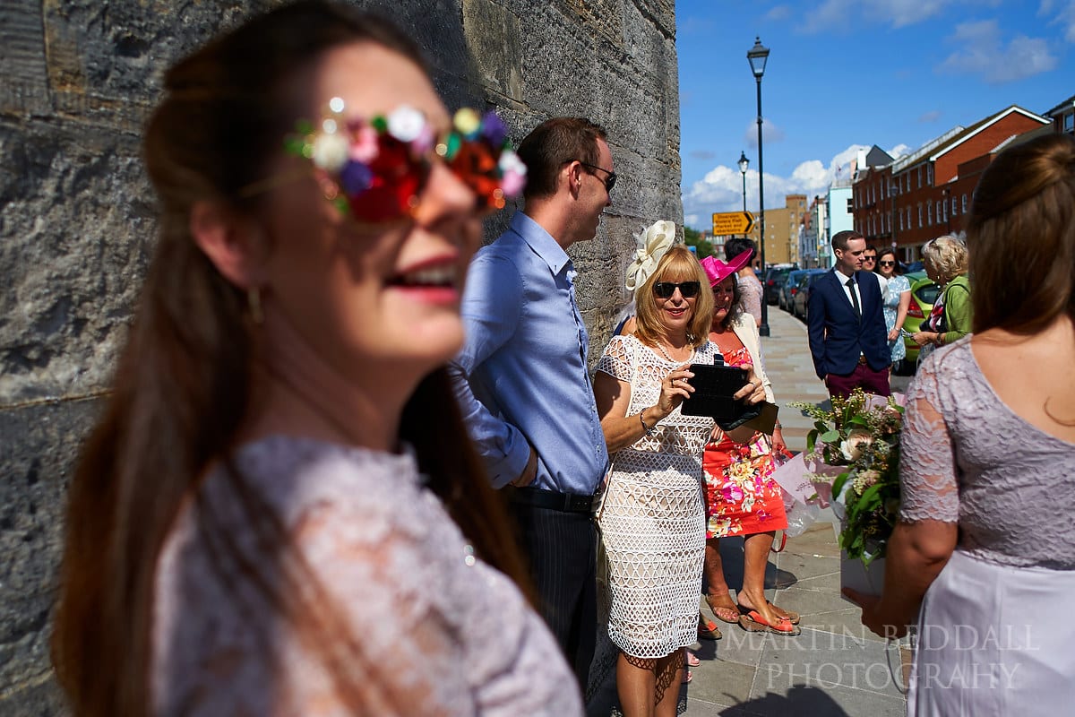 Wedding guests gather outside the Square Tower in Portsmouth