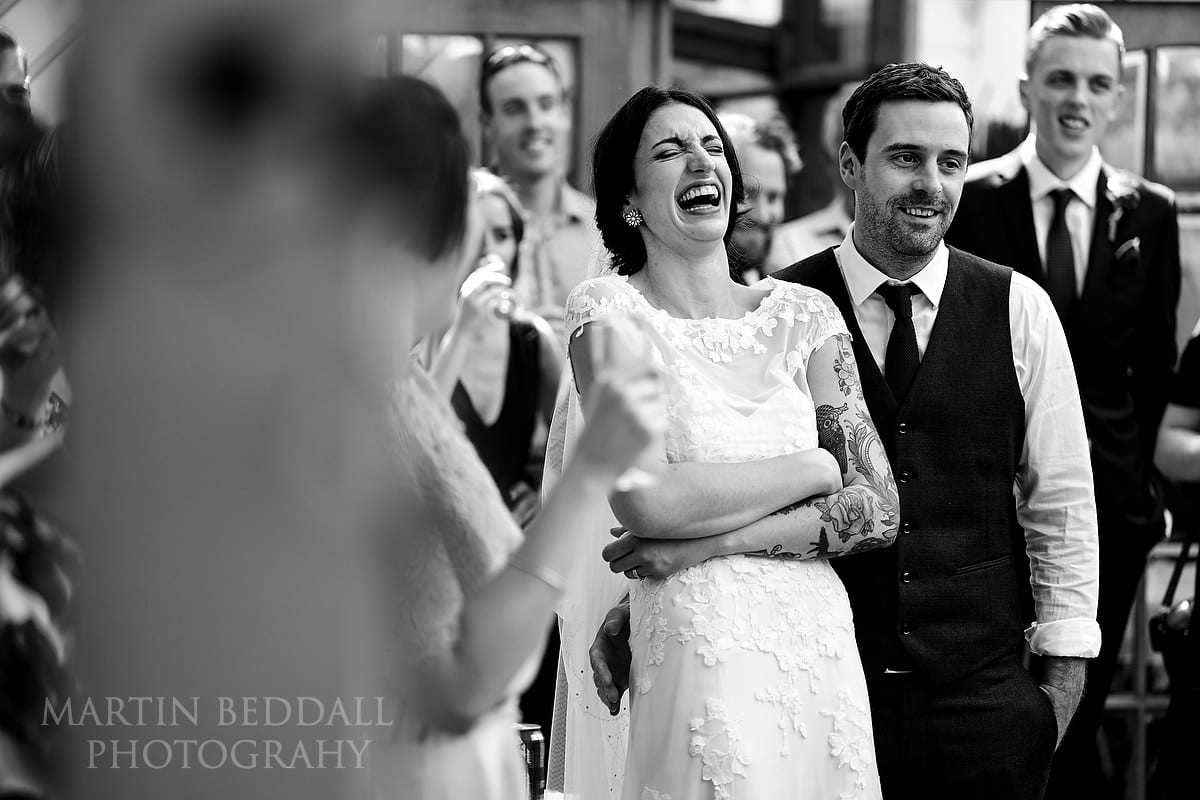 Bride laughing at speech