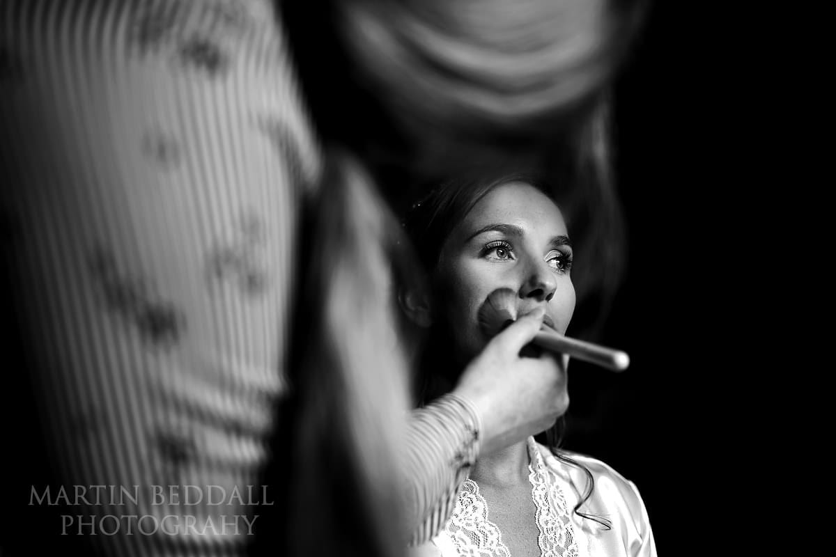 Bride getting ready at Dewsall Court