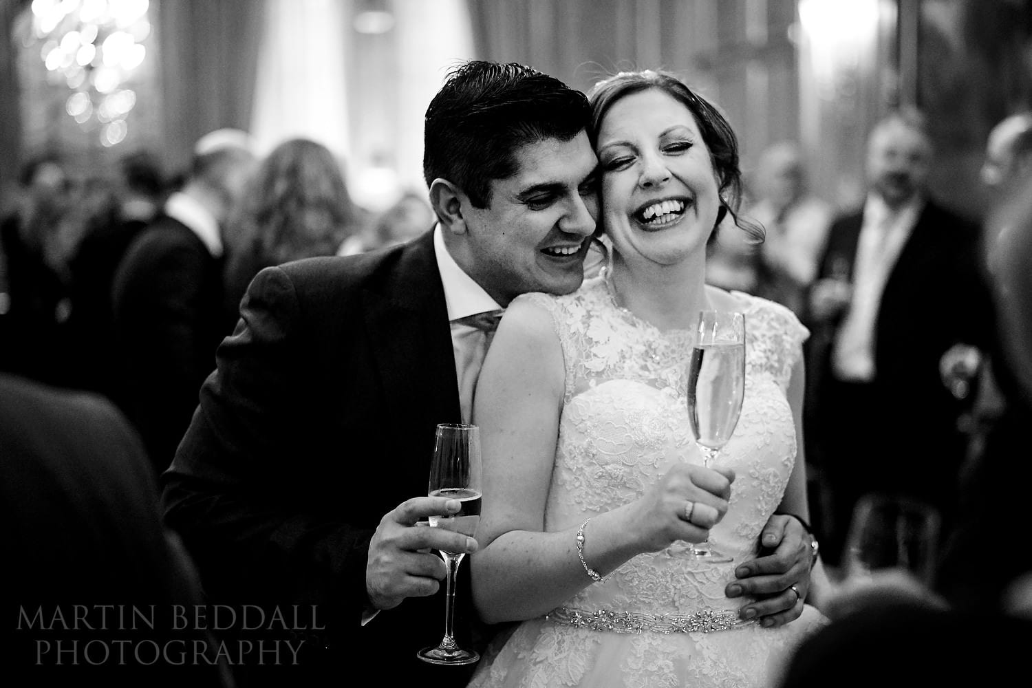 Natural moment between the bride and groom at Claridges wedding