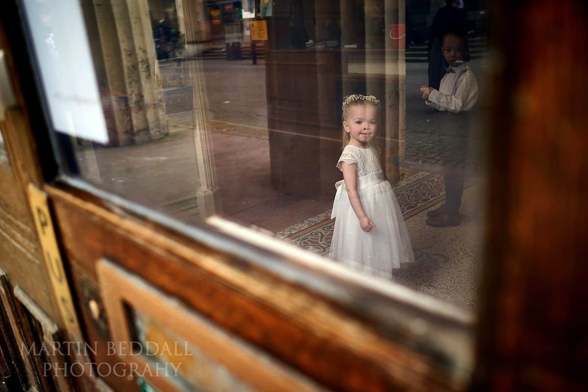 Flower girl waits for the bride at Brighton Town Hall wedding