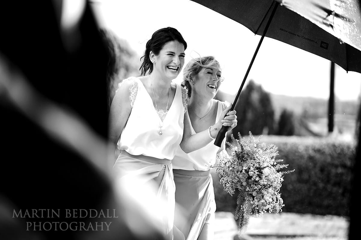 Bridesmaids arrive in sunshine