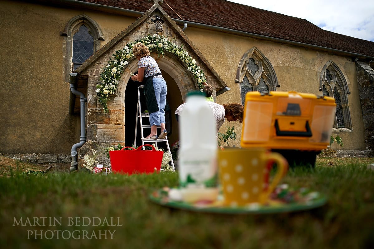 Florists arranging the flower arch at the Sussex church