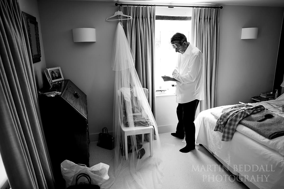 Father of the bride getting dressed