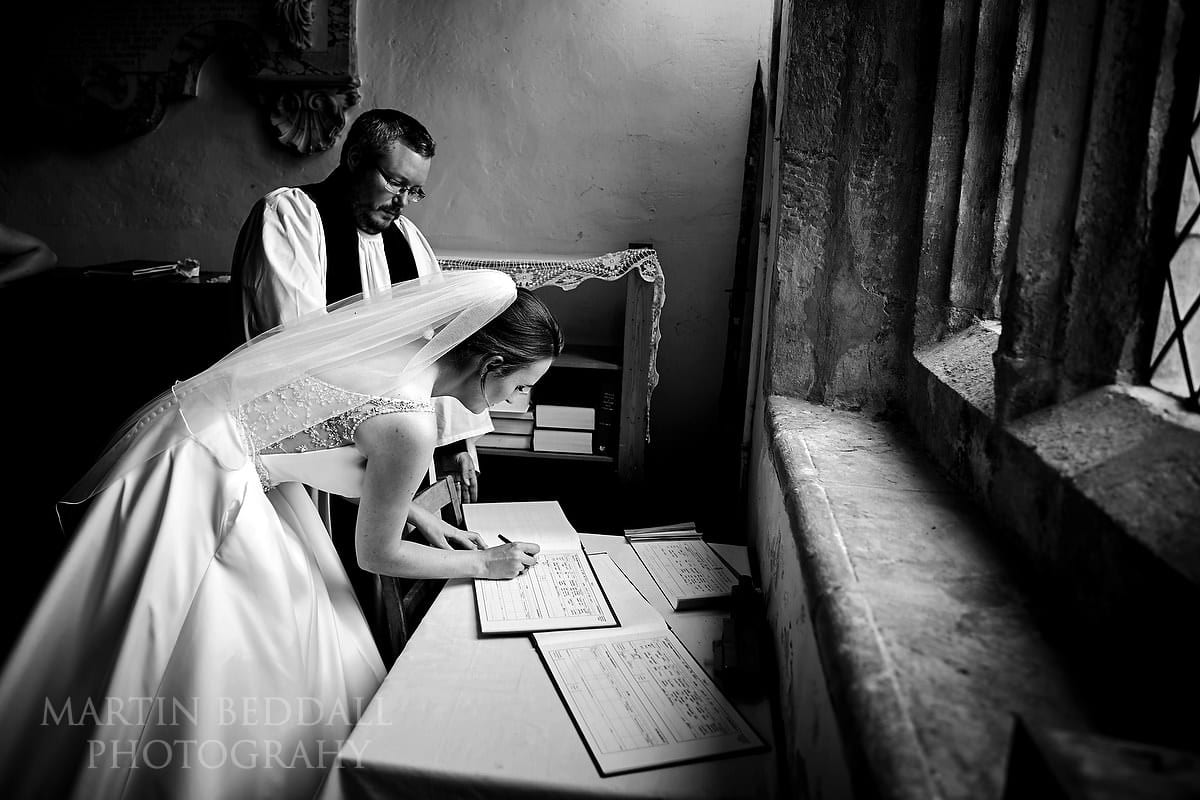 Bride signing the register