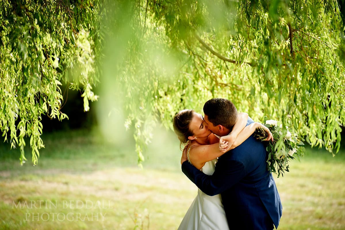 Bride and groom kiss