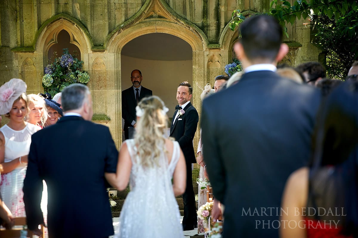 Groom at the end of the aisle