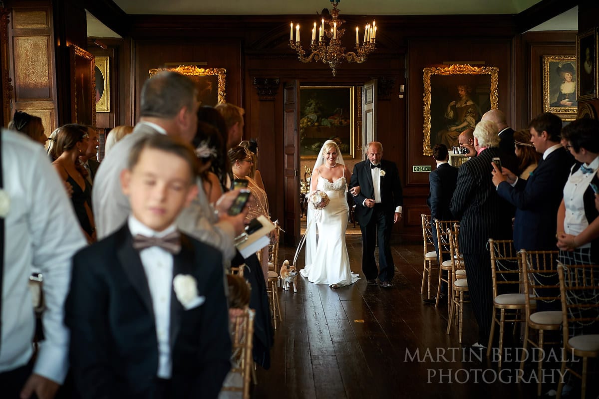 Bride walks down the aisle with her father at Glynde Place