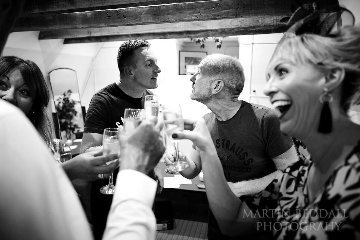 Drinks during prep for Sussex same-sex wedding