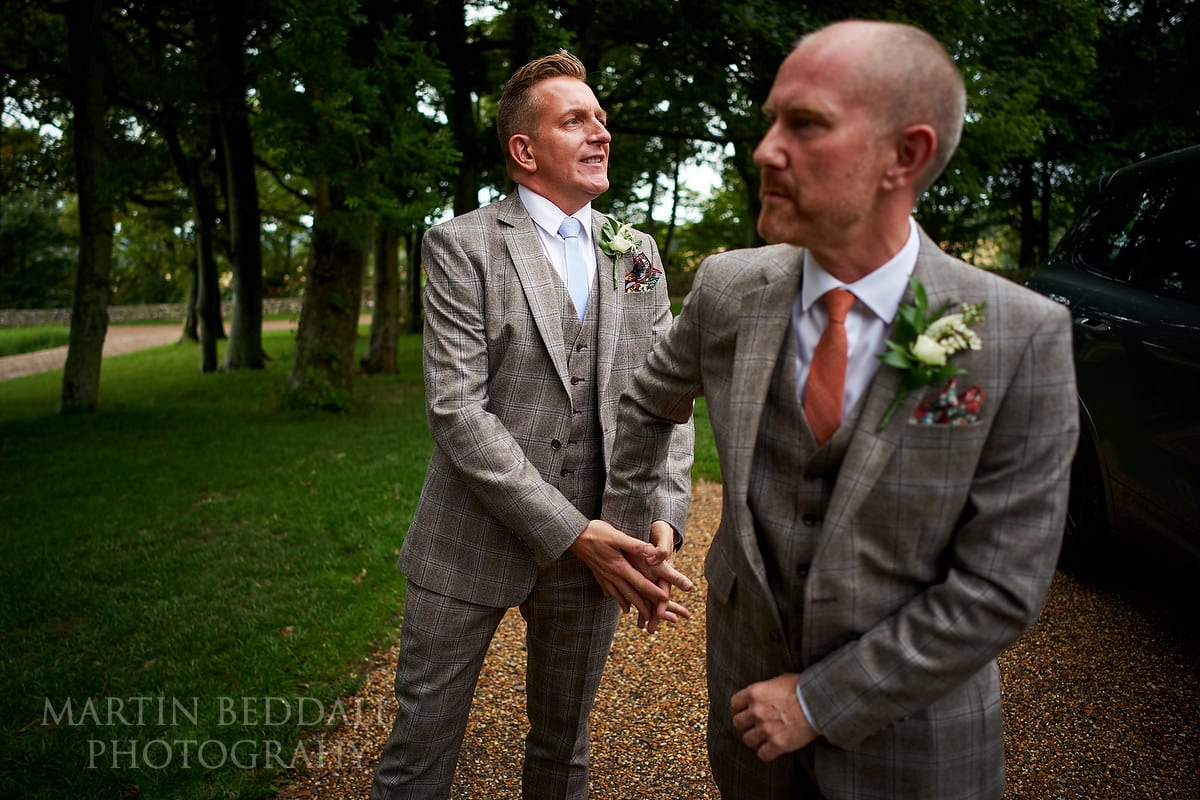 Grooms arrive at Cissbury Barns for their same-sex wedding