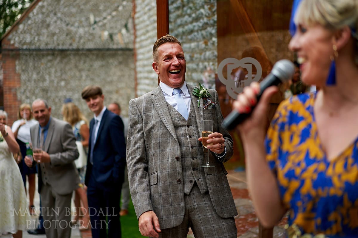 Wedding speeches outside the barn