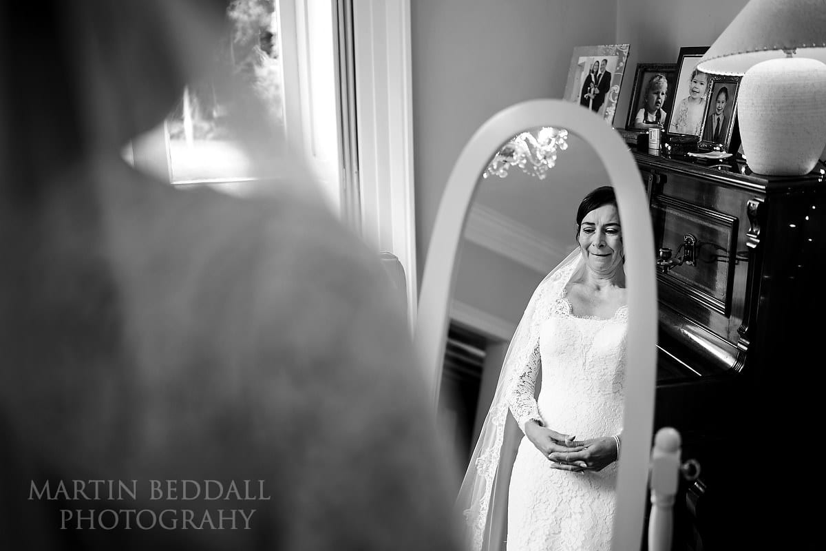 Emotional bride in her wedding dress