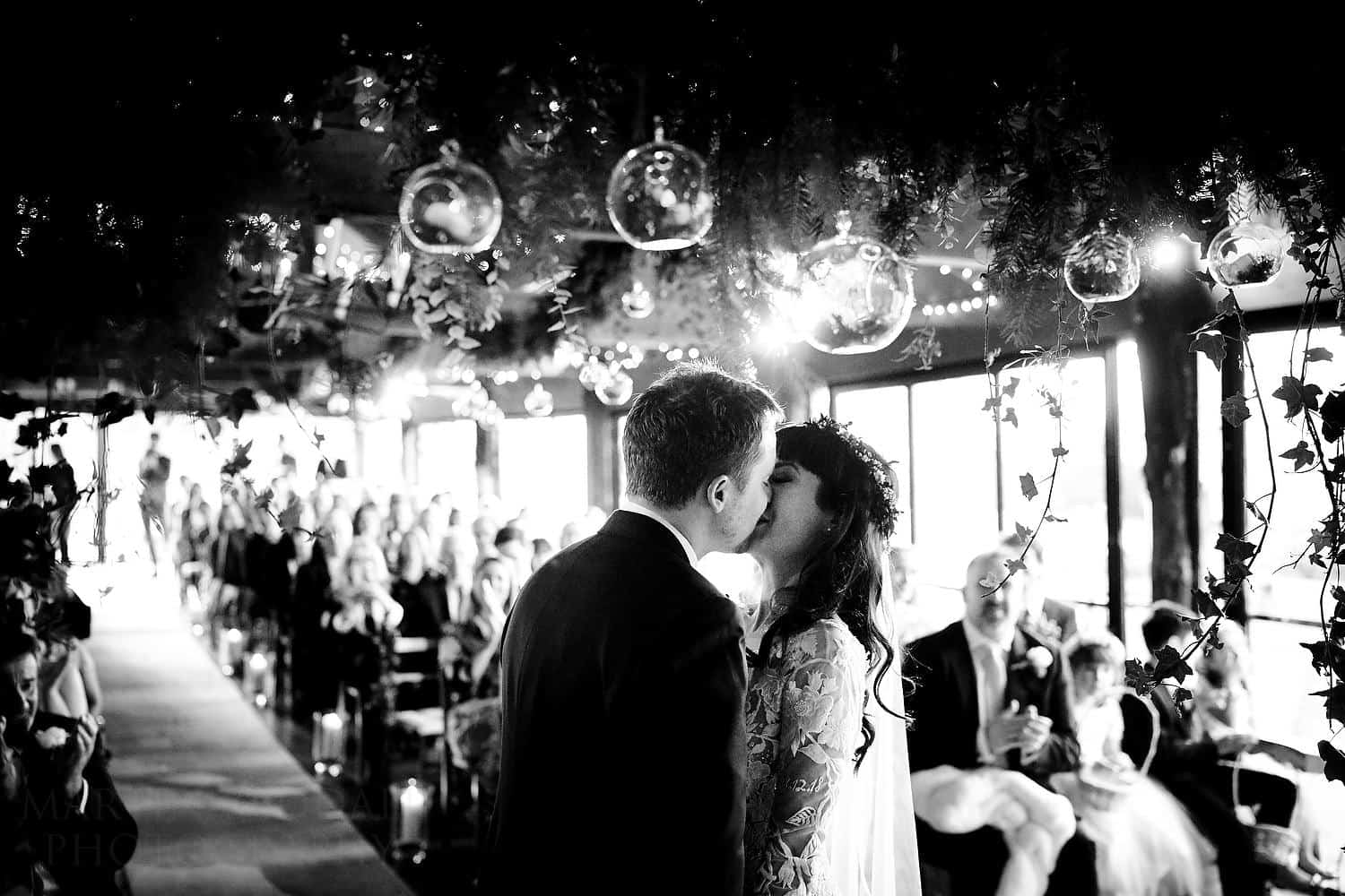 bride and groom kiss
