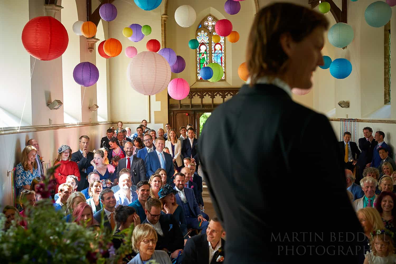 wedding guests watch the wedding ceremony