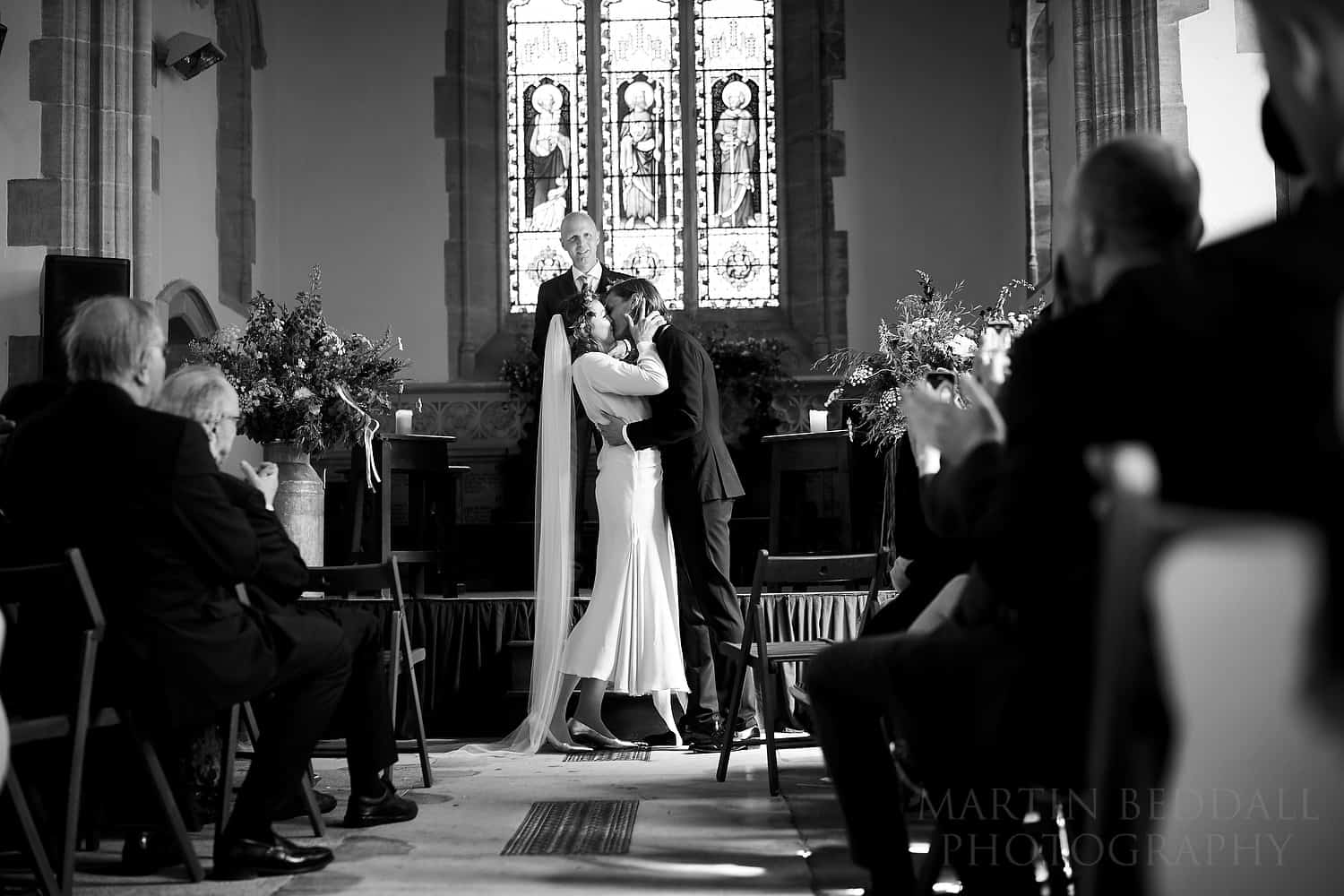 Bride and groom kiss