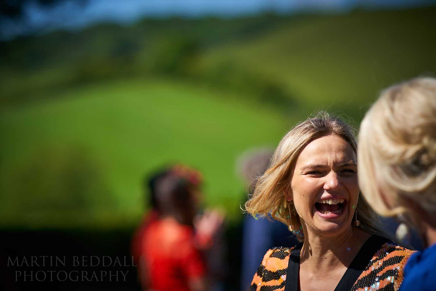 Laughing wedding guest