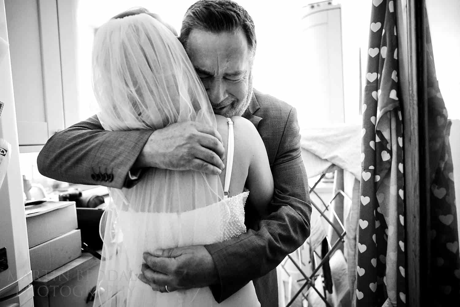 Hug for the bride from her emotional father