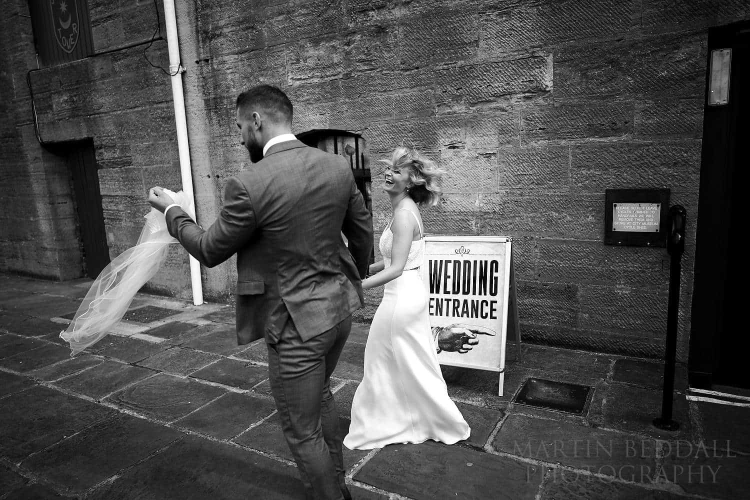 Groom catches the bride's veil