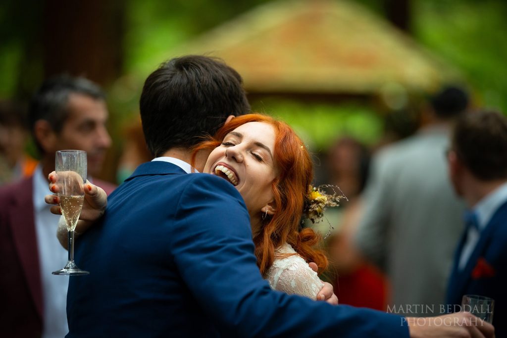 Hugging wedding guests