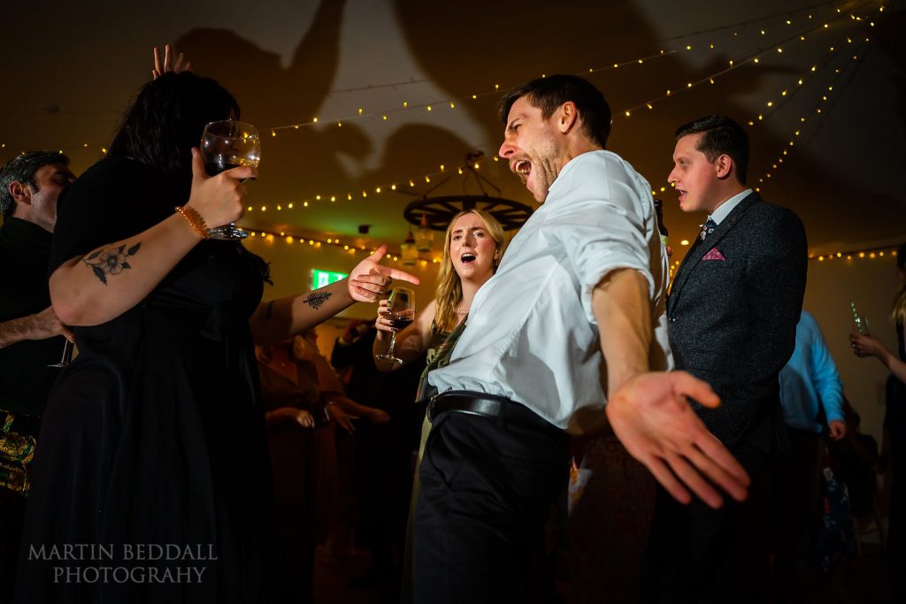 Wedding guests dance