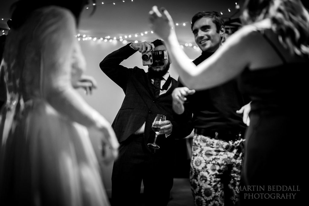 Wedding guest with a film camera