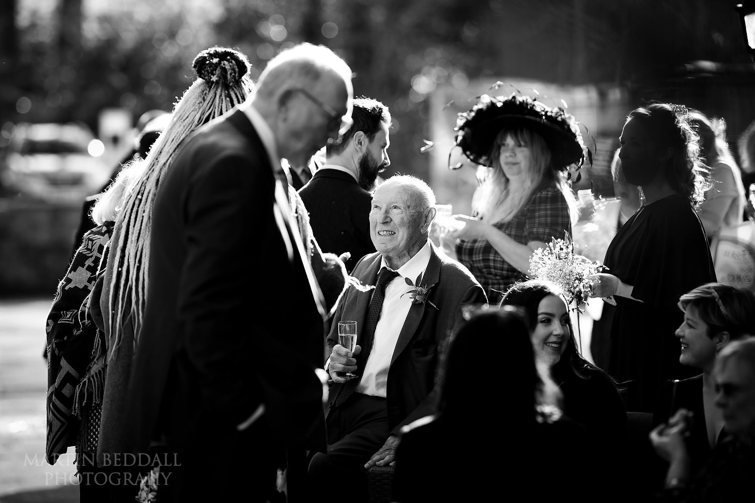Wedding guests in the winter sunshine at Hook Norton Brewery