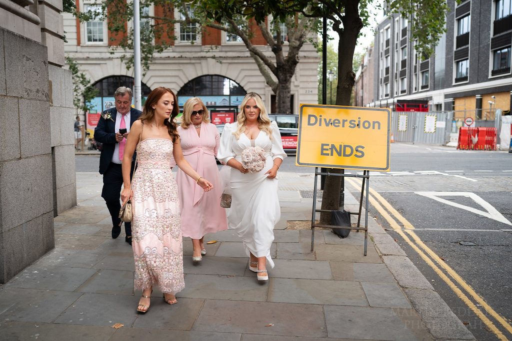 Bride and her family arrive for Chelsea Town Hall wedding