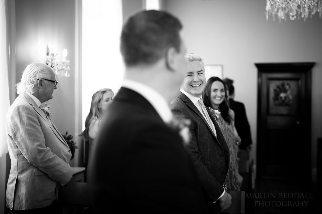 Groom's brother smiles