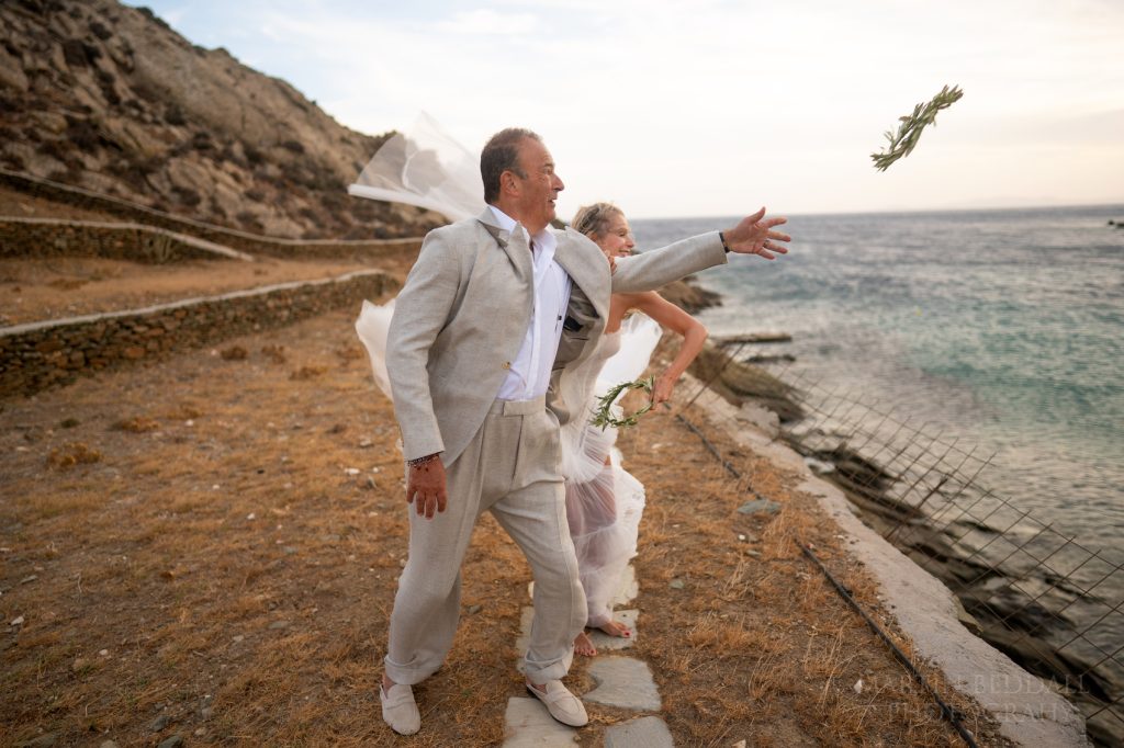 Throwing their wreaths into the sea