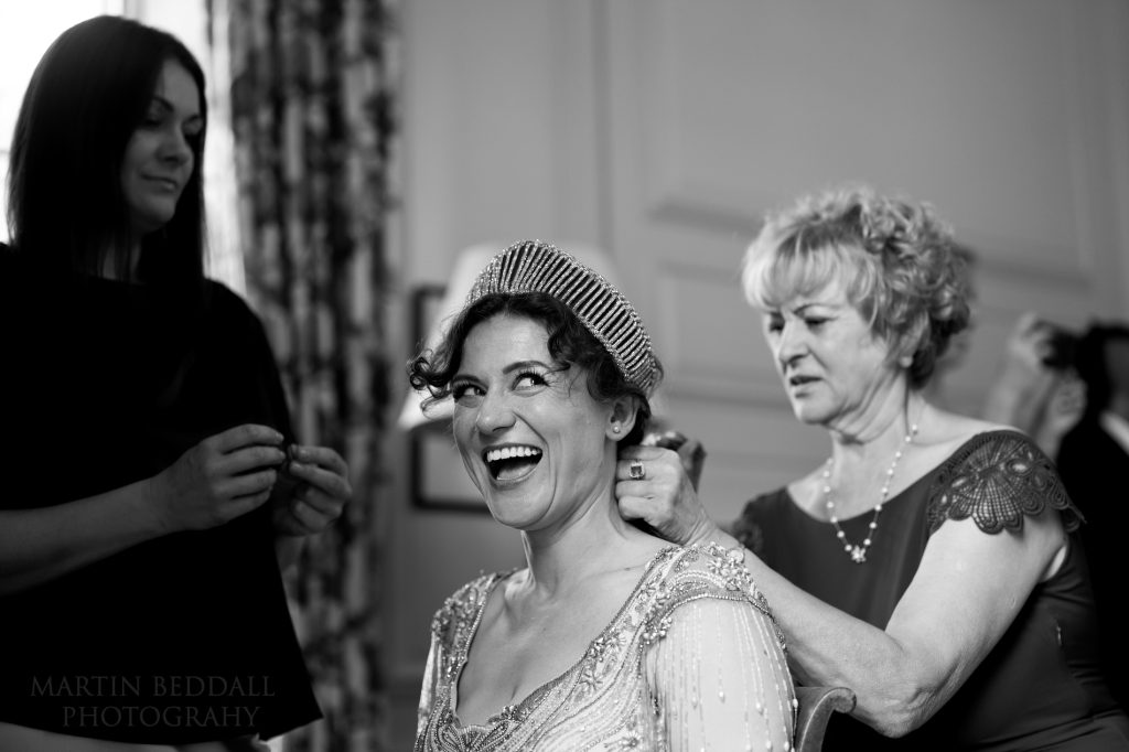 Bride getting ready with her mother and sister
