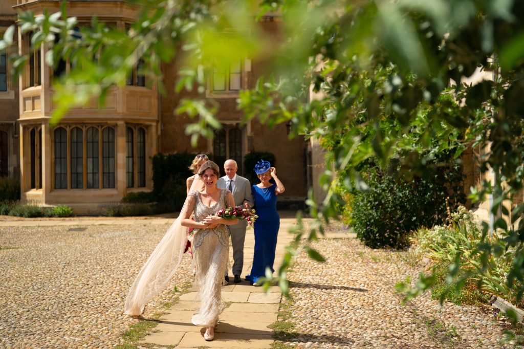 Bride walks to Trinity College Chapel