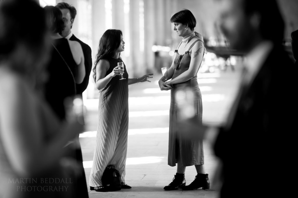 Wedding guests chat at Trinity College drinks reception